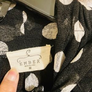 Black and white polkadot blouse.